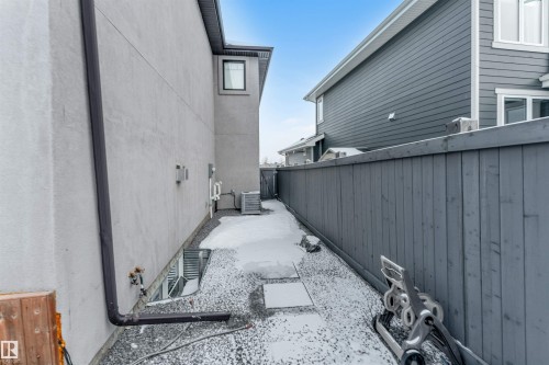 View of side of home with a central AC unit - 656 180 Street, Edmonton, AB - Outdoor With Exterior