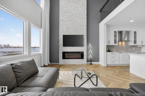 2017 Flycatcher Point(E), Edmonton, AB - Indoor Photo Showing Living Room With Fireplace