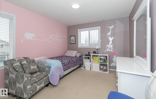 Bedroom with light carpet and baseboards - 20628 49 Avenue, Edmonton, AB - Indoor Photo Showing Bedroom