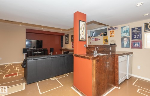 Indoor wet bar featuring recessed lighting and white dishwasher - 20628 49 Avenue, Edmonton, AB - Indoor