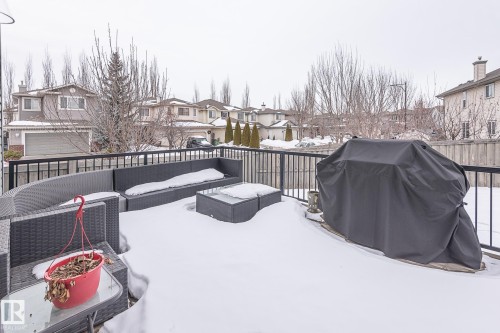 Wooden terrace with a grill, a residential view, and outdoor lounge area - 20628 49 Avenue, Edmonton, AB - Outdoor With Exterior