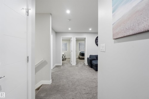 Hall with light carpet and recessed lighting - 452 Roberts Crescent, Leduc, AB - Indoor Photo Showing Other Room