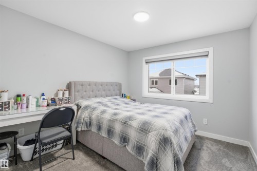 Bedroom featuring carpet and baseboards - 452 Roberts Crescent, Leduc, AB - Indoor Photo Showing Bedroom