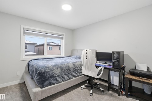 Carpeted bedroom featuring baseboards - 452 Roberts Crescent, Leduc, AB - Indoor Photo Showing Bedroom