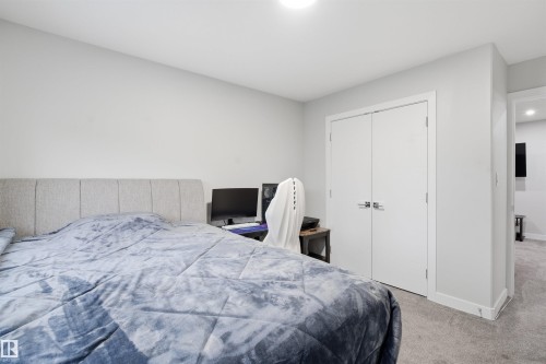 Bedroom with carpet and a closet - 452 Roberts Crescent, Leduc, AB - Indoor Photo Showing Bedroom