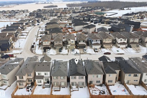 Snowy aerial view with a residential view - 452 Roberts Crescent, Leduc, AB - Outdoor With View