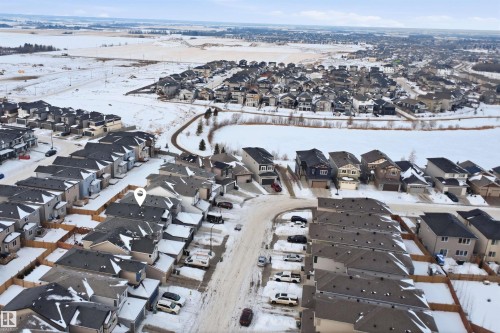 Snowy aerial view featuring a residential view - 452 Roberts Crescent, Leduc, AB - Outdoor With View