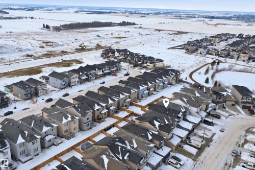 Snowy aerial view featuring a residential view - 452 Roberts Crescent, Leduc, AB -  With View