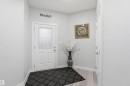Foyer entrance with baseboards and light wood finished floors - 452 Roberts Crescent, Leduc, AB  - Indoor Photo Showing Other Room 