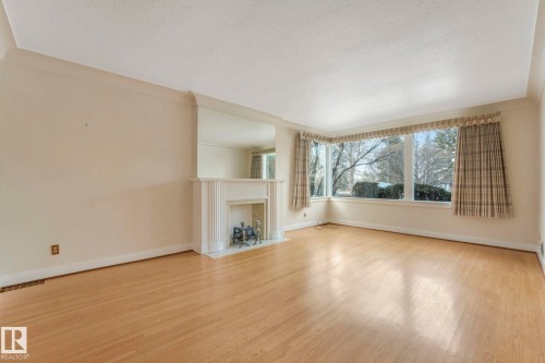 10429 Saskatchewan Drive, Edmonton, AB - Indoor Photo Showing Living Room With Fireplace