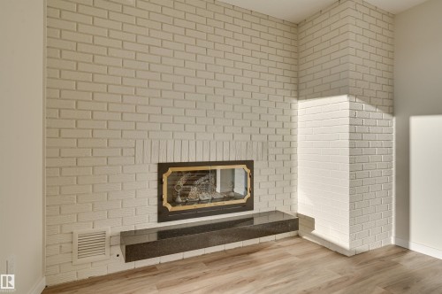 1 11960 100 Avenue, Edmonton, AB - Indoor Photo Showing Living Room With Fireplace