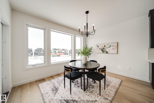 4 Cloutier Close, St. Albert, AB - Indoor Photo Showing Dining Room With Fireplace