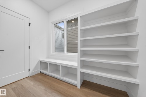 Mudroom with light wood finished floors - 6115 Crawford Drive, Edmonton, AB - Indoor