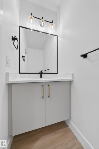 Bathroom with vanity and light wood-type flooring - 6115 Crawford Drive, Edmonton, AB - Indoor Photo Showing Other Room