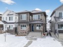 View of front of property with a balcony and stone siding - 6115 Crawford Drive, Edmonton, AB  - Outdoor With Facade 