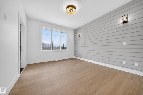 Unfurnished room with light wood finished floors - 6115 Crawford Drive, Edmonton, AB - Indoor Photo Showing Other Room