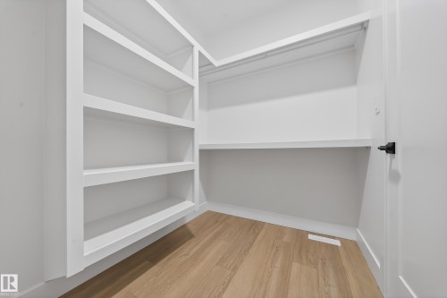 Walk in closet with light wood finished floors - 6115 Crawford Drive, Edmonton, AB - Indoor Photo Showing Other Room
