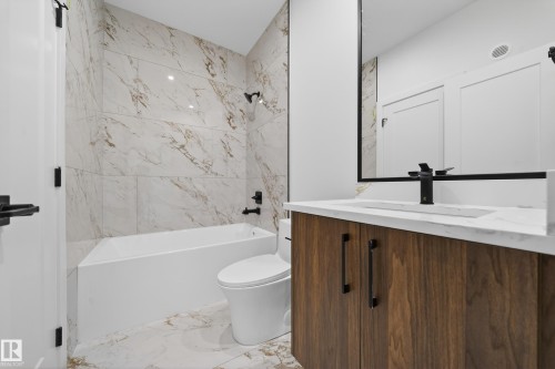 Full bathroom with light marble finish floors, vanity, and shower / washtub combination - 6115 Crawford Drive, Edmonton, AB - Indoor Photo Showing Bathroom