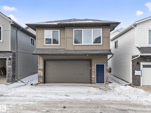 View of front of property with a garage and a shingled roof - 6115 Crawford Drive, Edmonton, AB - Outdoor