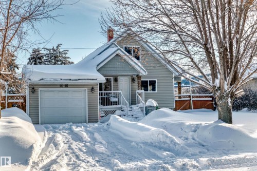 View of front facade with a chimney and a garage - 10115 104, Westlock, AB - Outdoor