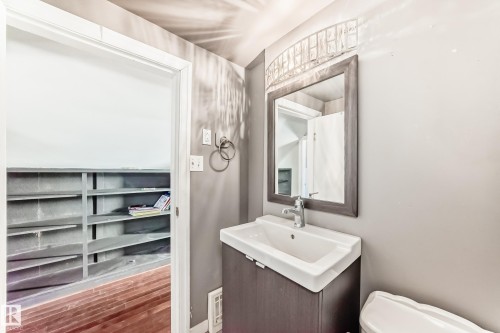Bathroom with vanity and wood finished floors - 10115 104, Westlock, AB - Indoor Photo Showing Bathroom