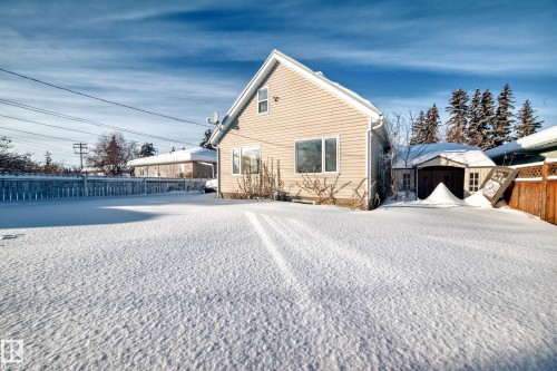 View of home's exterior with a storage unit - 10115 104, Westlock, AB - Outdoor