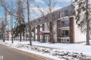 Snow covered property with a view of apartment building / complex - 102 10735 81 Avenue, Edmonton, AB  - Outdoor 