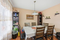 Dining space with wood finished floors - 