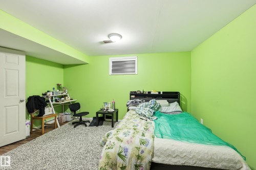 Bedroom with wood finished floors - 3010 32 Avenue Nw, Edmonton, AB - Indoor Photo Showing Bedroom