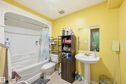 Full bath featuring shower / tub combo and toilet - 