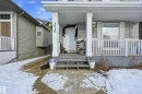 Snow covered property entrance with a porch - 3010 32 Avenue Nw, Edmonton, AB  - Outdoor With Deck Patio Veranda 