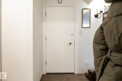 Doorway with baseboards and tile patterned floors - 