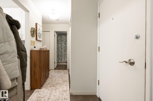Corridor with baseboards - 307 5730 Riverbend Road, Edmonton, AB - Indoor