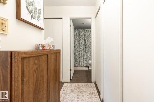Hall featuring dark tile patterned flooring - 307 5730 Riverbend Road, Edmonton, AB - Indoor Photo Showing Other Room