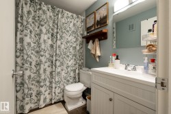 Full bathroom featuring vanity and curtained shower - 