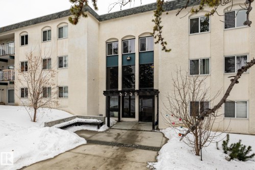 Snow covered property with a view of apartment building / complex - 307 5730 Riverbend Road, Edmonton, AB - Outdoor