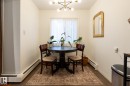 Dining space with a baseboard radiator and a chandelier - 307 5730 Riverbend Road, Edmonton, AB  - Indoor 