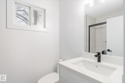 Bathroom with vanity and a marble finish shower - 5105 106A Street, Edmonton, AB - Indoor Photo Showing Bathroom
