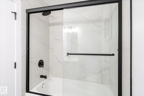Bathroom with shower / bath combination with glass door - 5105 106A Street, Edmonton, AB - Indoor Photo Showing Bathroom