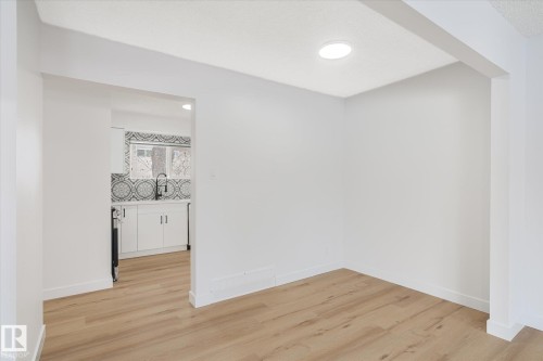 Spare room featuring light wood finished floors and recessed lighting - 5105 106A Street, Edmonton, AB - Indoor Photo Showing Other Room