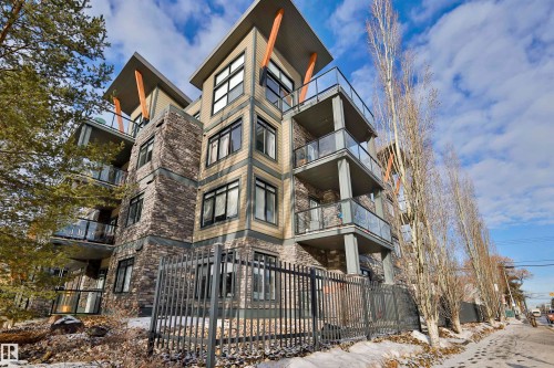 View of apartment building / complex with a fenced front yard - 203 9908 84 Avenue, Edmonton, AB - Outdoor With Balcony