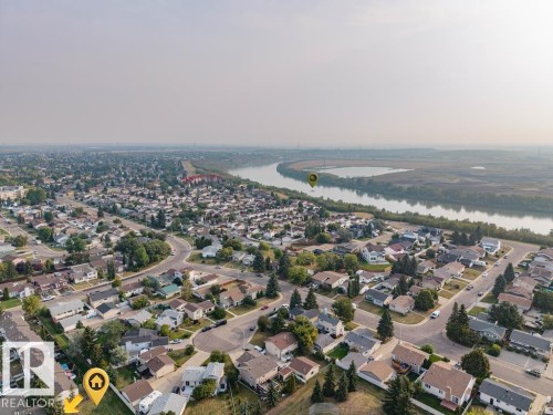 Aerial overview of property's location with nearby suburban area and the river - 2551 135 Avenue, Edmonton, AB - Outdoor With View