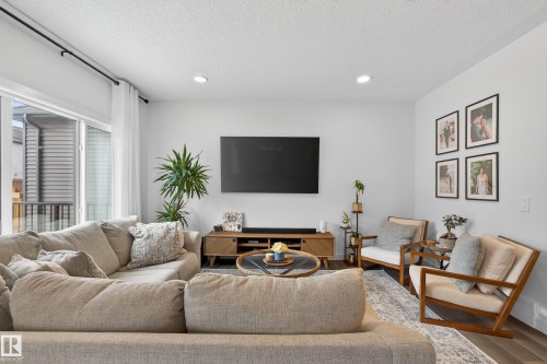 Living room featuring recessed lighting, a textured ceiling, and wood finished floors - 2098 Graydon Hill Crescent, Edmonton, AB - Indoor Photo Showing Living Room