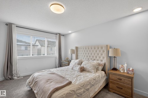 Carpeted bedroom with a textured ceiling and recessed lighting - 2098 Graydon Hill Crescent, Edmonton, AB - Indoor Photo Showing Bedroom