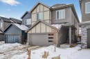 View of front of house with board and batten siding, a shingled roof, and an attached garage - 2098 Graydon Hill Crescent, Edmonton, AB  - Outdoor With Facade 