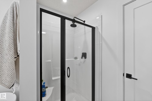 Bathroom featuring a stall shower, a textured ceiling, and recessed lighting - 2098 Graydon Hill Crescent, Edmonton, AB - Indoor Photo Showing Bathroom