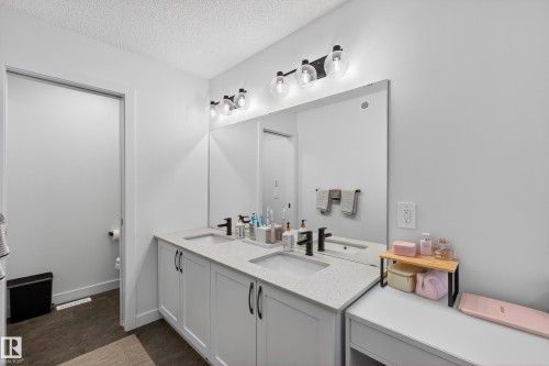 Bathroom with double vanity and a textured ceiling - 2098 Graydon Hill Crescent, Edmonton, AB - Indoor Photo Showing Bathroom