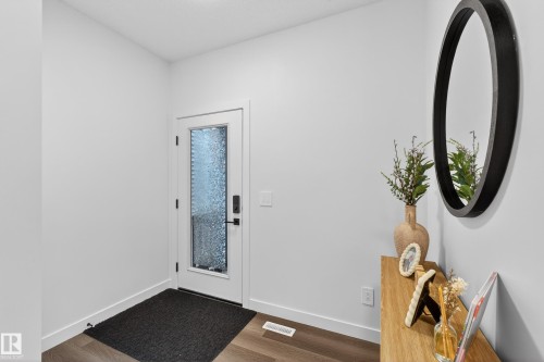 Entryway featuring dark wood-style flooring and baseboards - 2098 Graydon Hill Crescent, Edmonton, AB - Indoor Photo Showing Other Room