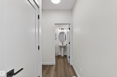 Hall featuring dark wood-style flooring and baseboards - 2098 Graydon Hill Crescent, Edmonton, AB - Indoor Photo Showing Other Room