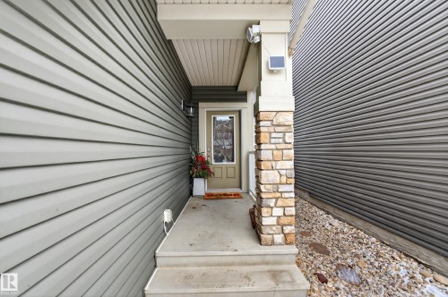 Entrance to property featuring stone siding - 5910 Anthony Crescent, Edmonton, AB - Outdoor With Exterior